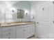 Well-lit bathroom with a granite countertop vanity and a decorative light fixture at 1328 Astoria Pkwy, Catawba, NC 28609