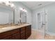 Dual sink vanity in the spacious primary bathroom with tile flooring at 1328 Astoria Pkwy, Catawba, NC 28609