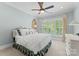 Cozy bedroom featuring a ceiling fan, natural light from the window, and light blue walls at 1328 Astoria Pkwy, Catawba, NC 28609