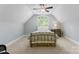 Neutral bedroom with a bed, carpeting, a dresser, a vaulted ceiling, and a large window at 1328 Astoria Pkwy, Catawba, NC 28609