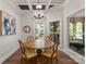 Casual dining area bathed in light, features a round table and views of the outdoor living space at 1328 Astoria Pkwy, Catawba, NC 28609