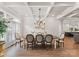 This dining room features wood floors, a decorative light fixture, an oval table, and seating for six at 1328 Astoria Pkwy, Catawba, NC 28609