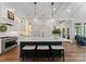 Modern kitchen with a large center island, white cabinetry, pendant lighting, and stainless steel appliances at 1328 Astoria Pkwy, Catawba, NC 28609