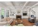 Open-concept living room with built-in shelving surrounding a fireplace and bright natural light at 1328 Astoria Pkwy, Catawba, NC 28609