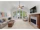 Inviting living room featuring a fireplace, large windows with water views, and plush seating at 1328 Astoria Pkwy, Catawba, NC 28609