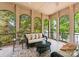 Relax on this elegant covered patio with stunning lake views, a perfect spot for entertaining at 1328 Astoria Pkwy, Catawba, NC 28609