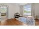Bright playroom with hardwood floors, a large window, and natural light at 1328 Astoria Pkwy, Catawba, NC 28609