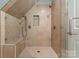 Contemporary shower featuring stone walls, a built-in bench, and glass doors at 1328 Astoria Pkwy, Catawba, NC 28609