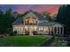 A sprawling backyard featuring a patio, a well-maintained lawn, and a charming waterfall feature at 1328 Astoria Pkwy, Sherrills Ford, NC 28673