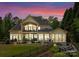 Spacious backyard with a patio, grill, manicured lawn, and a waterfall feature at 1328 Astoria Pkwy, Sherrills Ford, NC 28673
