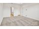 Bright bedroom features soft carpeting with access to an attached bathroom at 13756 Roderick Dr # 176, Huntersville, NC 28078