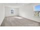 Bright bedroom featuring neutral walls, carpet and natural light at 13756 Roderick Dr # 176, Huntersville, NC 28078