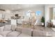 Bright, open-concept living space with modern decor, a dining area, and a view of the well-equipped kitchen at 13756 Roderick Dr # 176, Huntersville, NC 28078