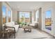 Inviting sunroom filled with natural light, comfortable seating, and a view of the outdoor scenery at 13756 Roderick Dr # 176, Huntersville, NC 28078