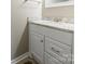 Bathroom featuring single sink vanity with granite countertops and updated cabinet fixtures at 1400 Fern Forest Dr, Gastonia, NC 28054
