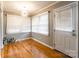 Cozy dining room with hardwood floors, large windows, modern light fixture, and lots of natural light at 1400 Fern Forest Dr, Gastonia, NC 28054