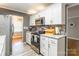 Updated kitchen featuring modern appliances, granite countertops, and wood look flooring at 1400 Fern Forest Dr, Gastonia, NC 28054
