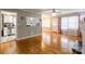 Spacious living room with hardwood floors seamlessly connecting to the kitchen area at 1400 Fern Forest Dr, Gastonia, NC 28054