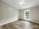 Bedroom with wood-look flooring and a window at 141 Hickory Creek Dr, Gastonia, NC 28052