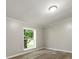 Bedroom with hardwood floors and a view of the outdoors at 141 Hickory Creek Dr, Gastonia, NC 28052