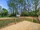 Large wooden deck overlooking a green lawn at 141 Hickory Creek Dr, Gastonia, NC 28052