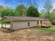 Ranch house with a deck and carport at 141 Hickory Creek Dr, Gastonia, NC 28052
