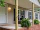 The house has a charming covered front porch with brick steps, ferns, and a small sitting area at 141 Hickory Creek Dr, Gastonia, NC 28052