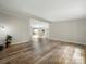 Open-concept living space with light paint, modern laminate flooring, and backyard views at 141 Hickory Creek Dr, Gastonia, NC 28052