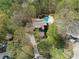 Overhead shot of a home with a backyard oasis including a sparkling pool, surrounded by a lush, wooded landscape at 1437 Jules Ct, Charlotte, NC 28226