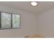 This bedroom with light wood floors and a window offers a bright and airy living space at 1437 Jules Ct, Charlotte, NC 28226