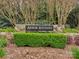 Elegant stone entrance sign for Arbor Estates, surrounded by lush greenery, creating a welcoming atmosphere at 1437 Jules Ct, Charlotte, NC 28226