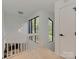 Bright hallway with modern lighting, large windows, and sleek finishes at 1437 Jules Ct, Charlotte, NC 28226