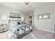 Nicely decorated bedroom featuring a large bed, unique wall art, and bright decor at 1471 Hubert Graham Way, Tega Cay, SC 29708