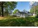 Spacious backyard showcasing the rear exterior and surrounding trees at 1532 Hunt Club Ct, Rock Hill, SC 29732
