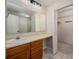 Bathroom with a large vanity, open closet and tiled floors at 1532 Hunt Club Ct, Rock Hill, SC 29732