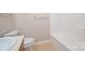 Bright bathroom featuring a white toilet and a bathtub with white tile surround at 1532 Hunt Club Ct, Rock Hill, SC 29732