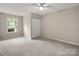 Bright bedroom with a ceiling fan, closet, and neutral walls at 1532 Hunt Club Ct, Rock Hill, SC 29732