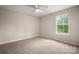 Bright bedroom with a ceiling fan, and a window for natural light at 1532 Hunt Club Ct, Rock Hill, SC 29732