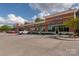 Commercial building with diverse businesses, brick facade, and easily accessible parking spaces at 1532 Hunt Club Ct, Rock Hill, SC 29732