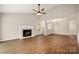 Bright living room boasting hardwood floors, a fireplace, ceiling fan, and vaulted ceiling at 1532 Hunt Club Ct, Rock Hill, SC 29732