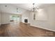 Spacious living room with hardwood floors, fireplace, and glass doors leading to outdoor space at 1532 Hunt Club Ct, Rock Hill, SC 29732