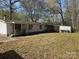 Backyard view of home with covered area and detached garage at 1586 Brook Ln, Denver, NC 28037
