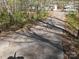 Cracked driveway with view of the house, truck and property in the background at 1586 Brook Ln, Denver, NC 28037