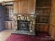 Living room stone fireplace with built in bookshelves on either side at 1586 Brook Ln, Denver, NC 28037