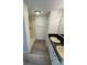 Bathroom featuring a shower and a double sink vanity with a black countertop at 1628 B Se Ave, Hickory, NC 28602