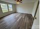 Well-lit bedroom showcasing laminate flooring and an inviting window at 1628 B Se Ave, Hickory, NC 28602