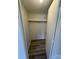 Walk-in closet with laminate flooring, shelf, and a door ajar at 1628 B Se Ave, Hickory, NC 28602