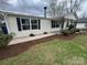 Well-maintained single-story home with freshly mulched garden beds and a paved walkway at 1628 B Se Ave, Hickory, NC 28602