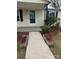 Charming home entrance with landscaped flower beds and concrete walkway at 1628 B Se Ave, Hickory, NC 28602