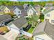 Aerial view of homes featuring private backyards, patios, and lush greenery at 16431 Leavitt Ln, Davidson, NC 28036